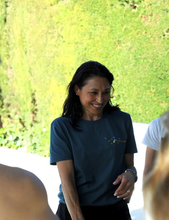 Nuria leading a breathwork session on the ridge